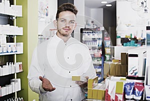 Man druggist in pharmacy photo