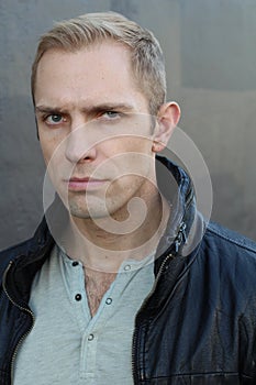 Man with dubious look close up