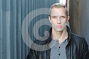 Man with dubious look close up with copy space