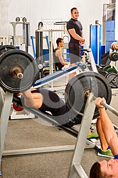 Man dumbell workout in gym. Muscle male working dumbbells body .