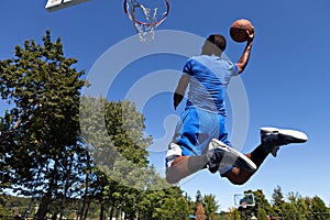 Man Dunking a Basketball