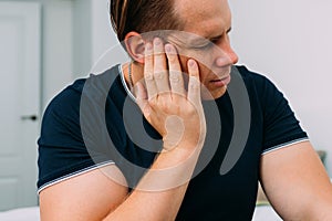 Man ear is inflated and suffers from pain