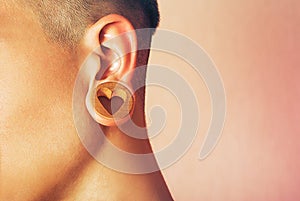 Man with earlobe hole. photo