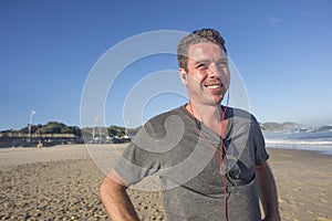 Man with Earphones by Beach