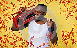 Man ears the music with an old stereo and dances. emotional and energetic expression. yellow background