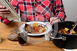 A man eat beef carrot