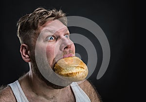 Man eating a big bread