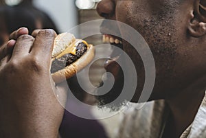 Man eating a big hamburger