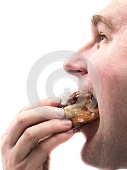 Man eating donut photo