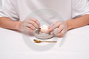 man eating egg for breakfast close-up hands