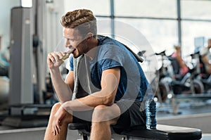 Man eating energy bar photo