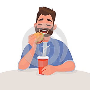 Man is eating fast food. The concept of unhealthy diet and wrong