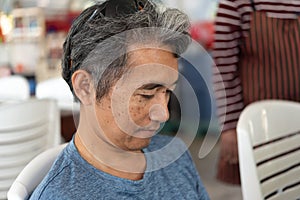 Man eating food on dining table in restaurant