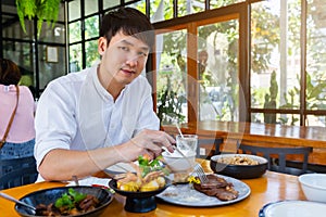 Man eating food in restaurant