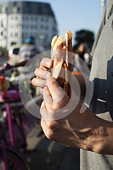 Man eating a german ham sandwich