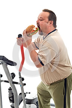 Man eating a large hamburger