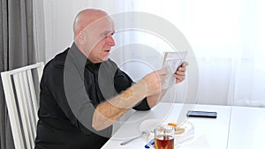 Man Eating Lunch Read Newspaper Bad News and Gesticulate Nervous and Irritated