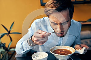 man eating lunch in a restaurant hot broth food break at work