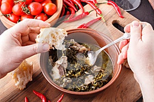 Man eating meat soup