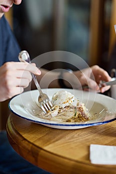 Man eating pasta close-up