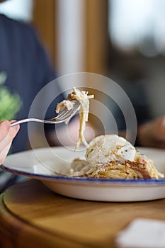 Man eating pasta close-up