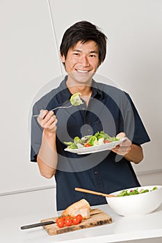 Man Eating Salad