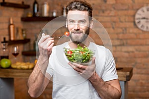 Man eating salad