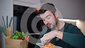 Man eating spaghetti with gluttony