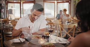 Man, eating and talking with food in restaurant at lunch with woman on date at table with fine dining. Happy, person and