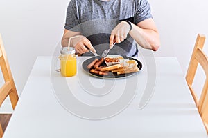 Man eating traditional full English breakfast