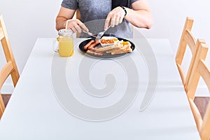 Man eating traditional full English breakfast