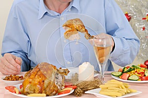 Man eating turkey photo