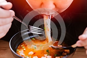 Man eating very hot and spicy noodle tasty yummy