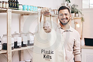 Man at eco friendly grocery store, recycling shopping bag and commitment to climate change at sustainable small business