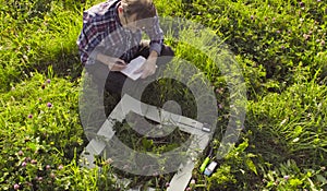 The man ecologist making notes in the diary