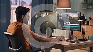 Man editing video on computer