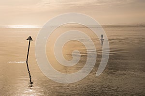 Man on a Electric surfboard rides in a calm and relaxing seascape