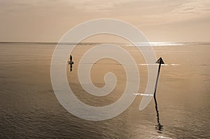 Man on a Electric surfboard rides in a calm and relaxing seascape