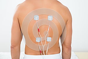 Man with electrodes on his back