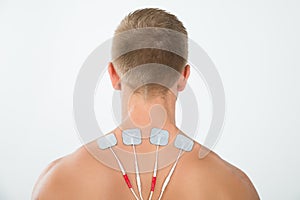Man with electrodes on neck