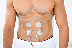 Man with electrodes on stomach