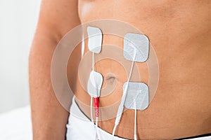 Man with electrodes on stomach