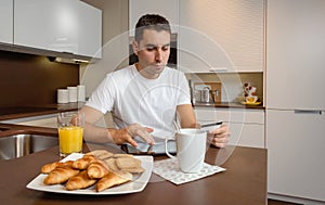 Man with electronic tablet and credit card