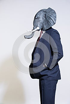 Man with an elephant mask on a light background