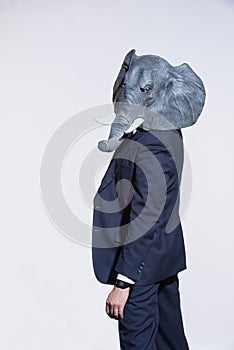 Man with an elephant mask on a light background