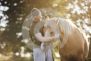 Man embracing of therappy horse