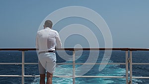 Man on the empty deck of a cruise liner