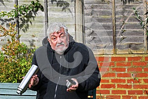 Man with an empty vacuum flask.