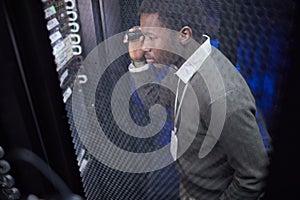 Man Engaging with Device in Data Center Environment