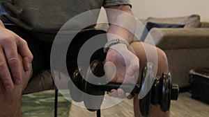 Man Engaging in Indoor Strength Training Exercise With Dumbbell at Home